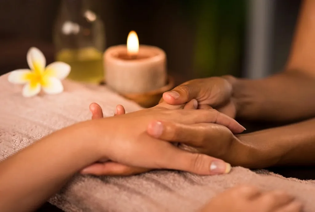 Hand massage in a warm, relaxing atmosphere